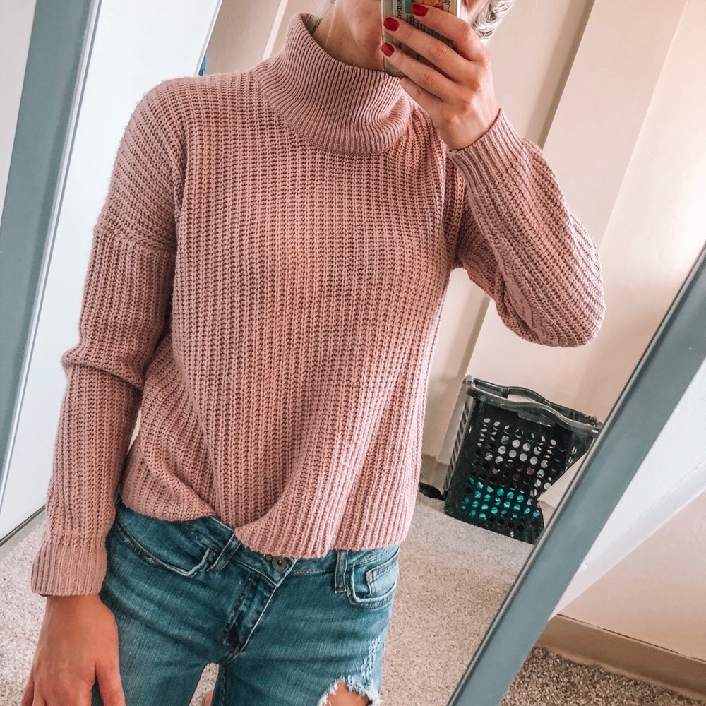 Blush pink turtleneck sweater with lace up back